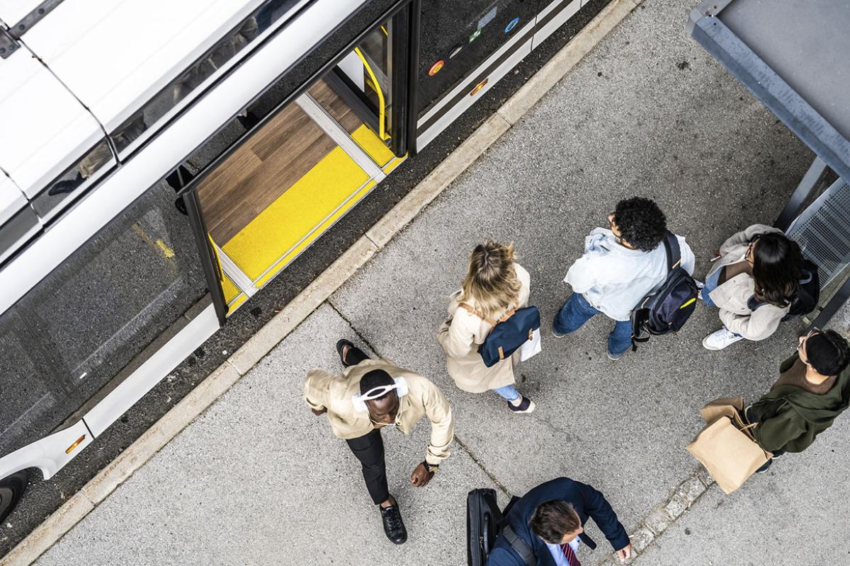 People waiting for bus at transport stop