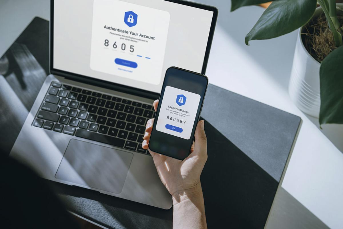 Smartphone and laptop displaying two-factor authentication
