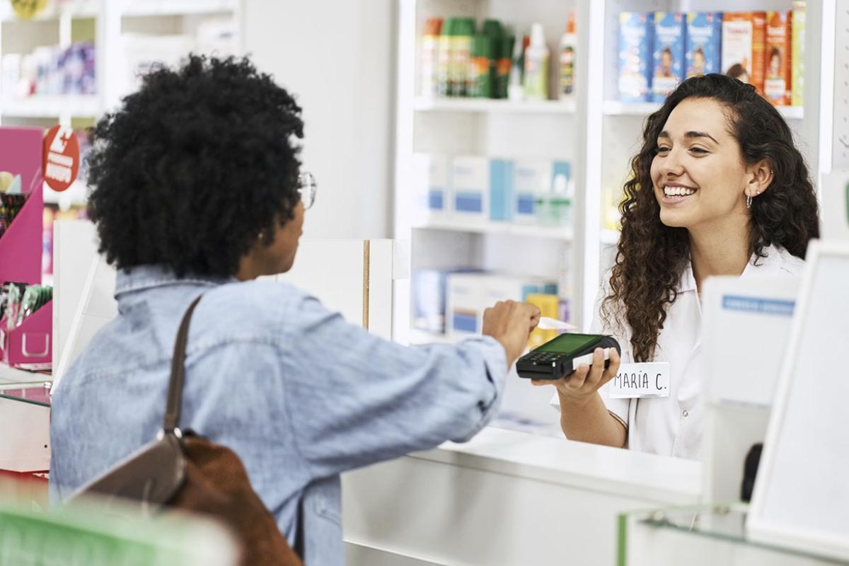 Female customer makes a purchase at a pharmacy