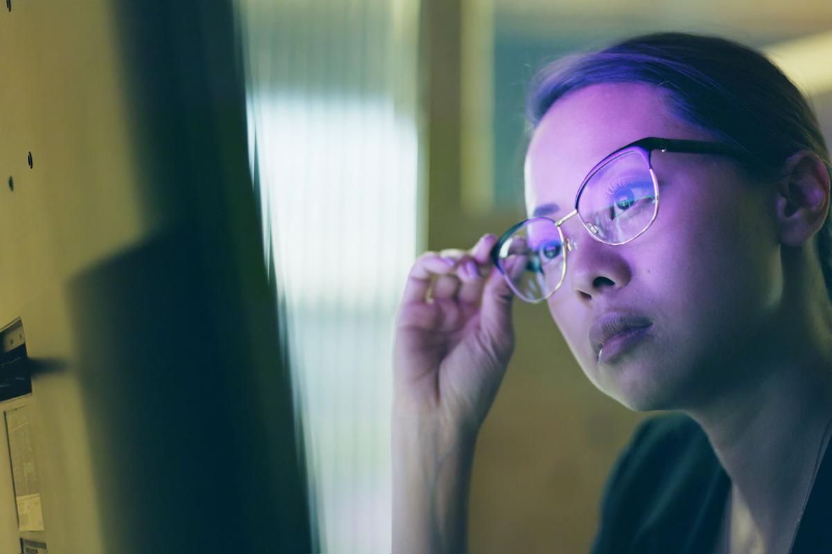 Person studying information on a computer screen