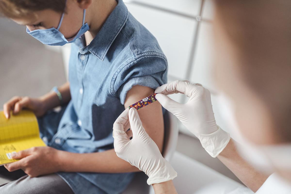 Child bandaged after receiving vaccination