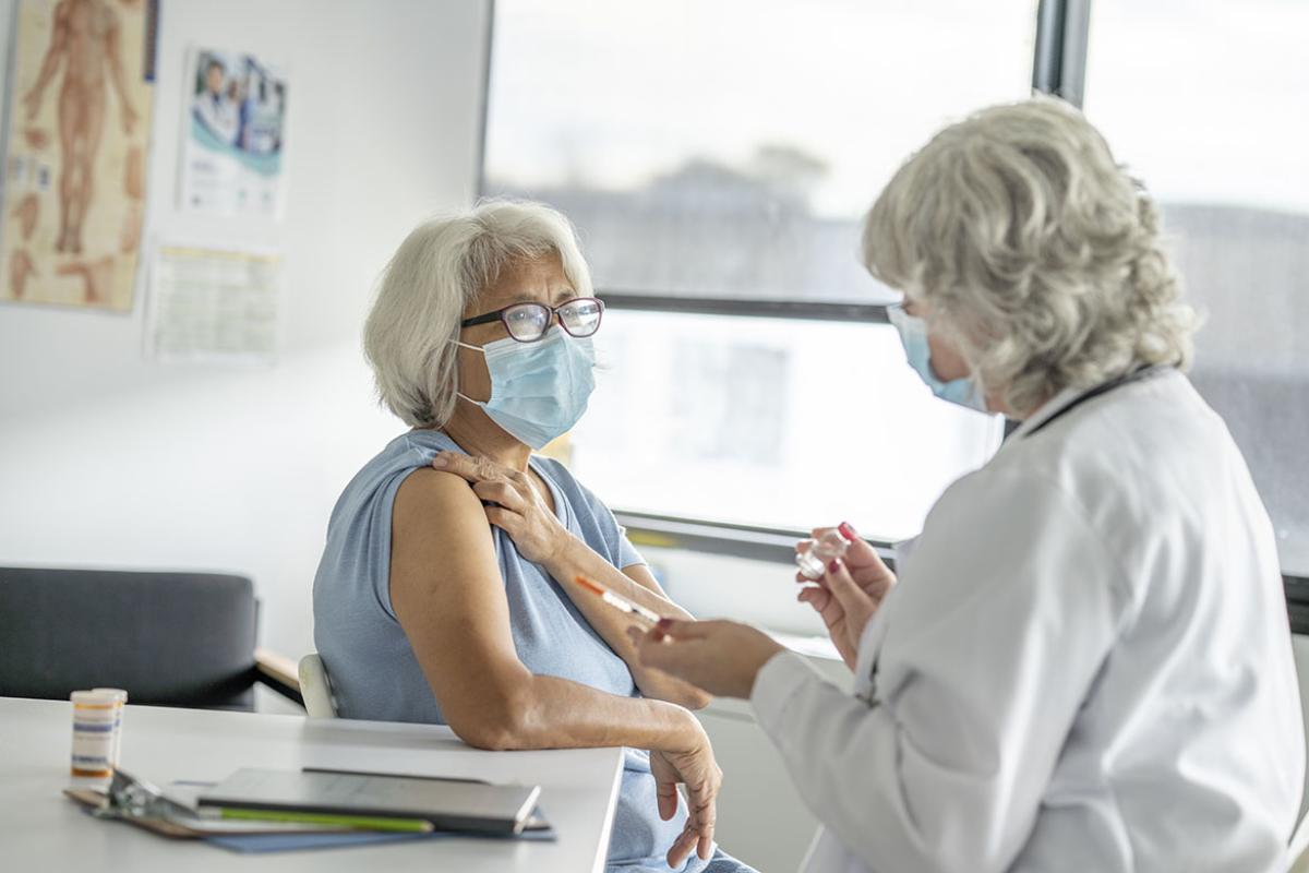 Physician in discussion with a patient
