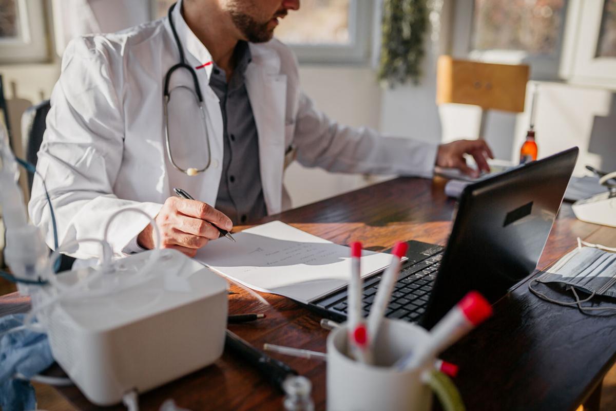 Physician completing paperwork