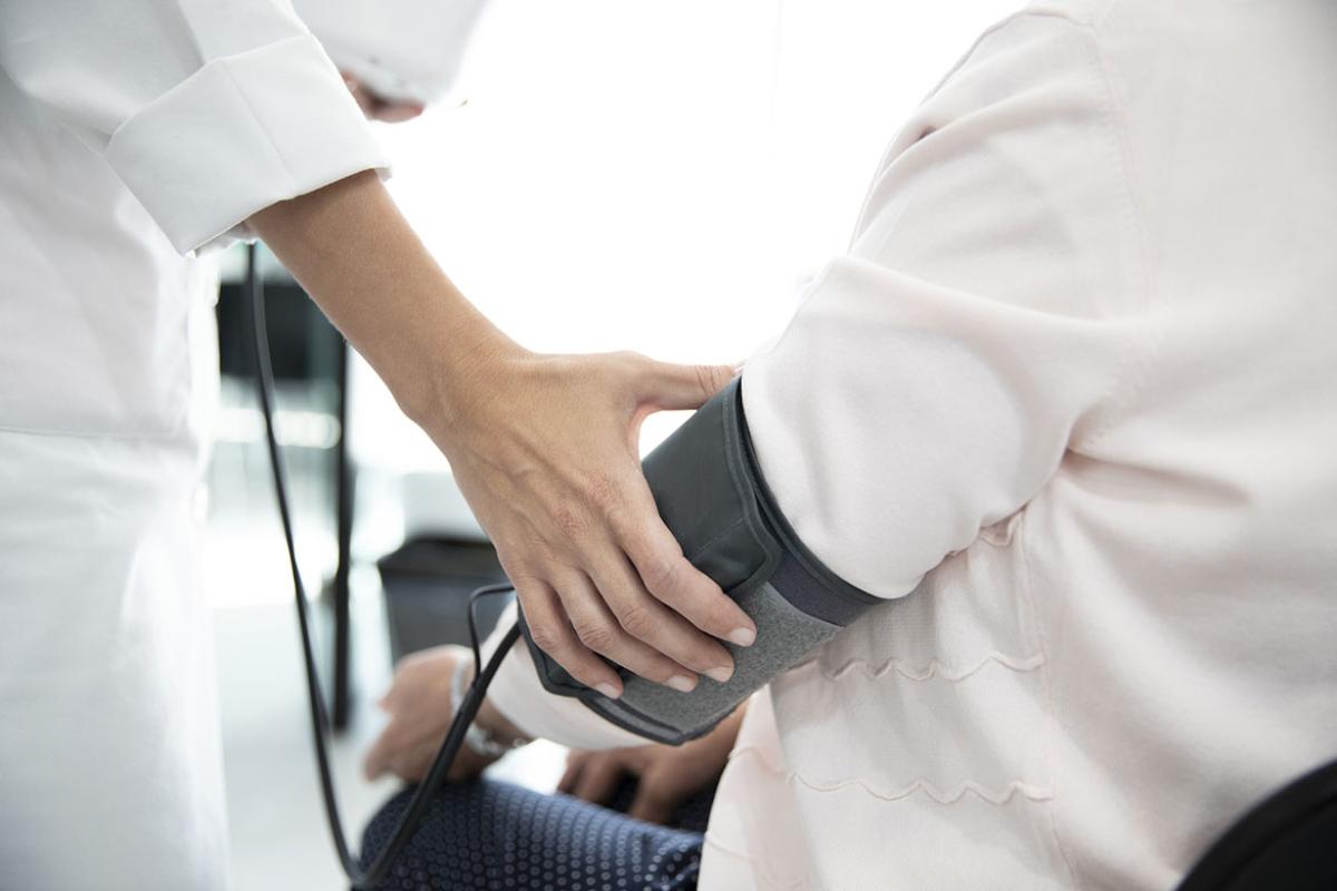 Person having blood pressure measured