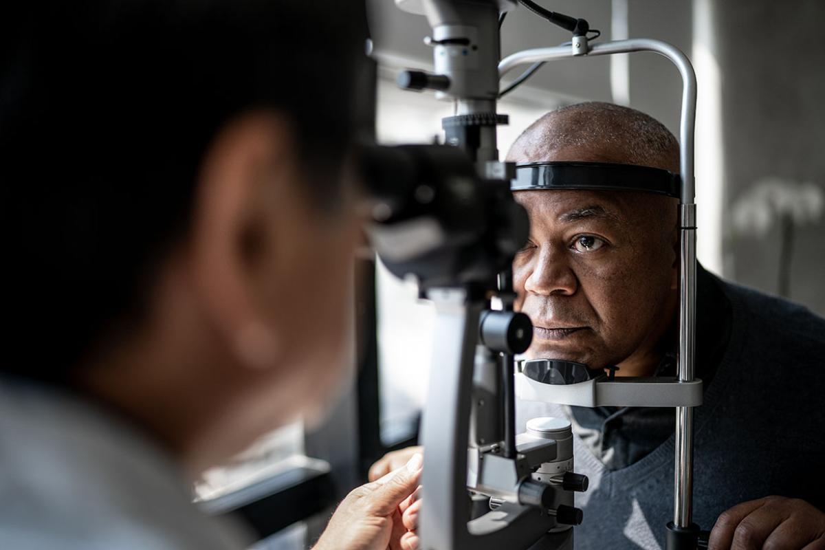 Ophthalmologist examining patient's eyes 