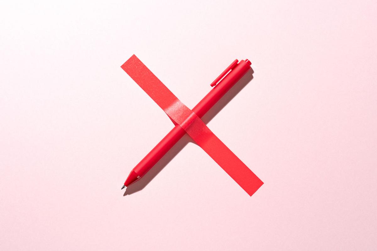 Pen and a piece of tape forming an X