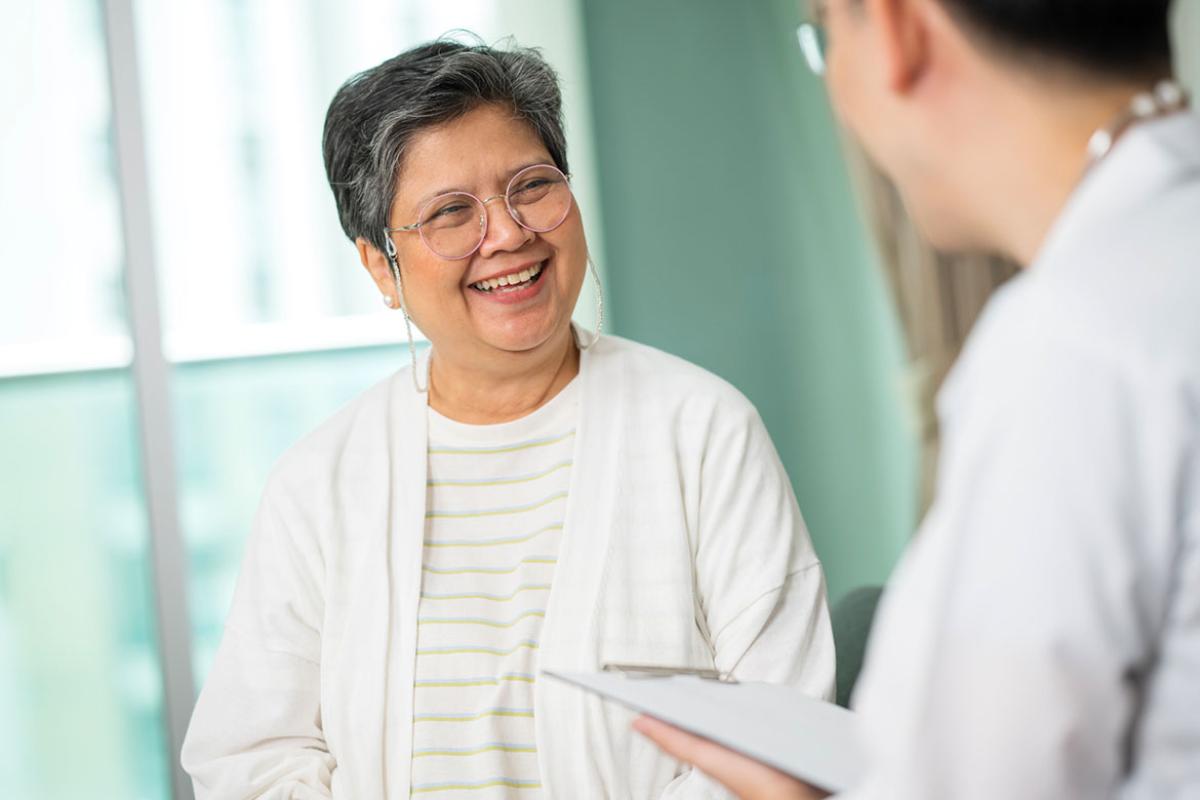 Patient in discussion with health care worker
