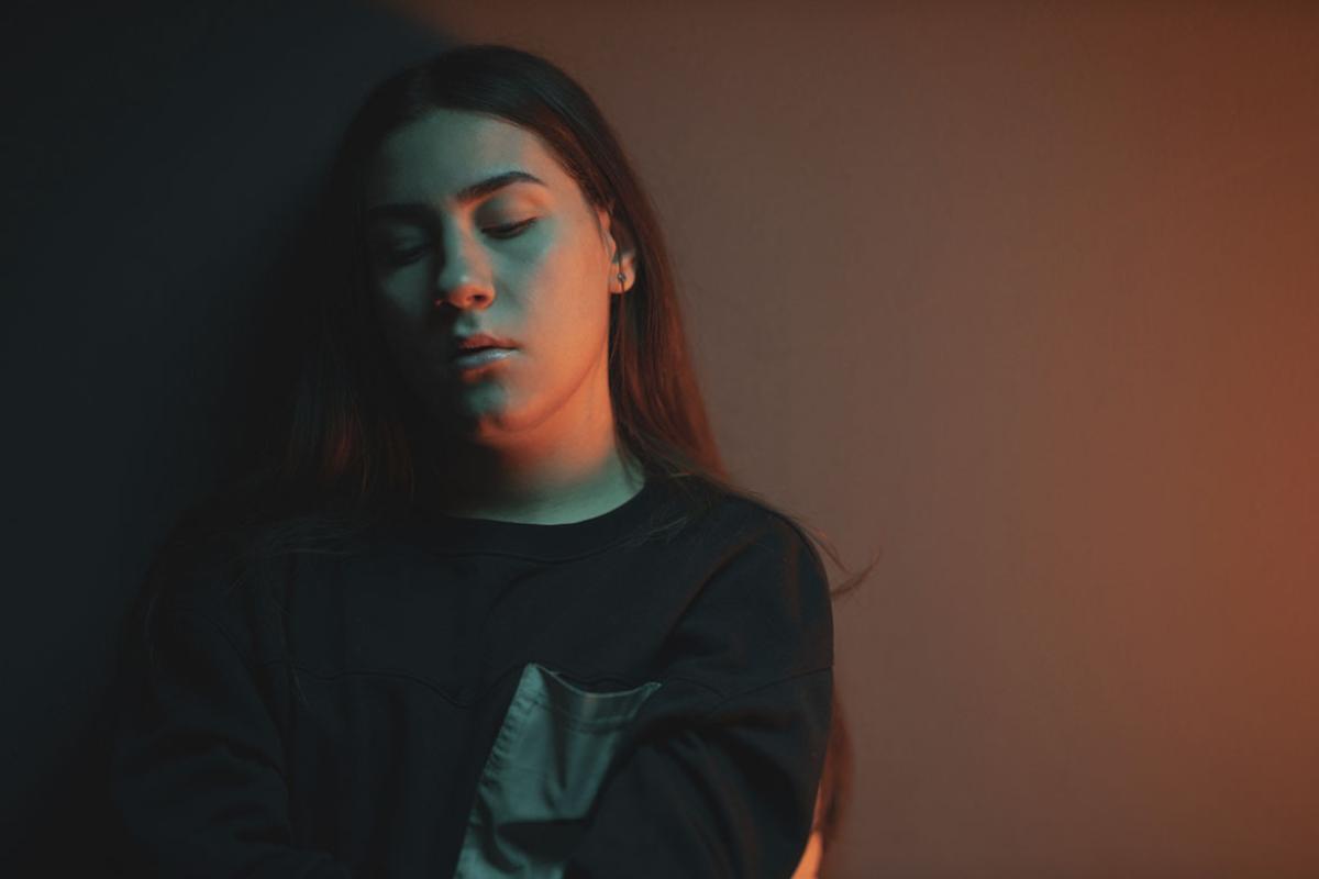 Solemn teenager with eyes closed