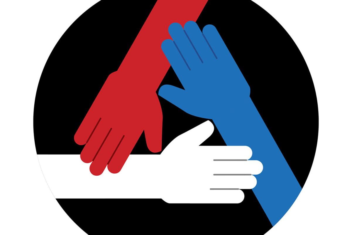 Three hands in different colors reaching towards each other