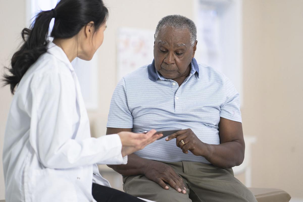 Senior patient consulting with physician