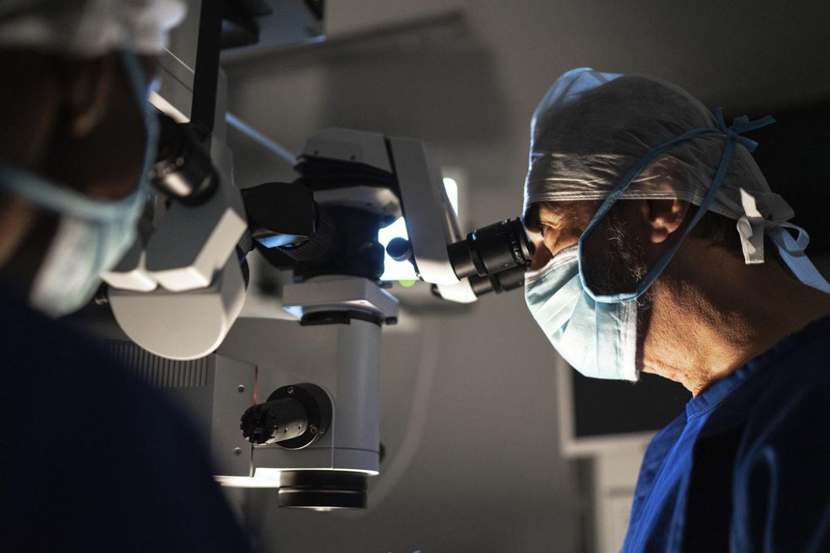 Doctors performing an exam or surgery
