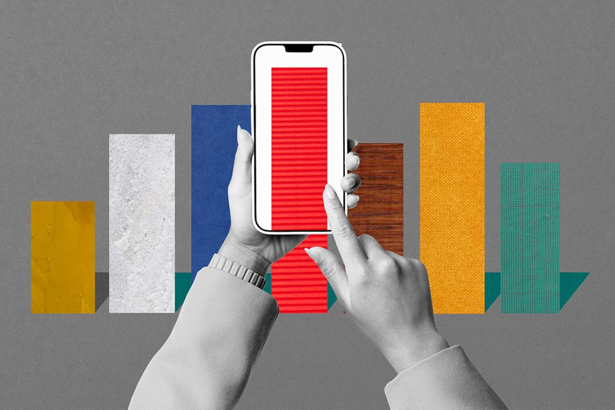Hands using smartphone to view bar graph