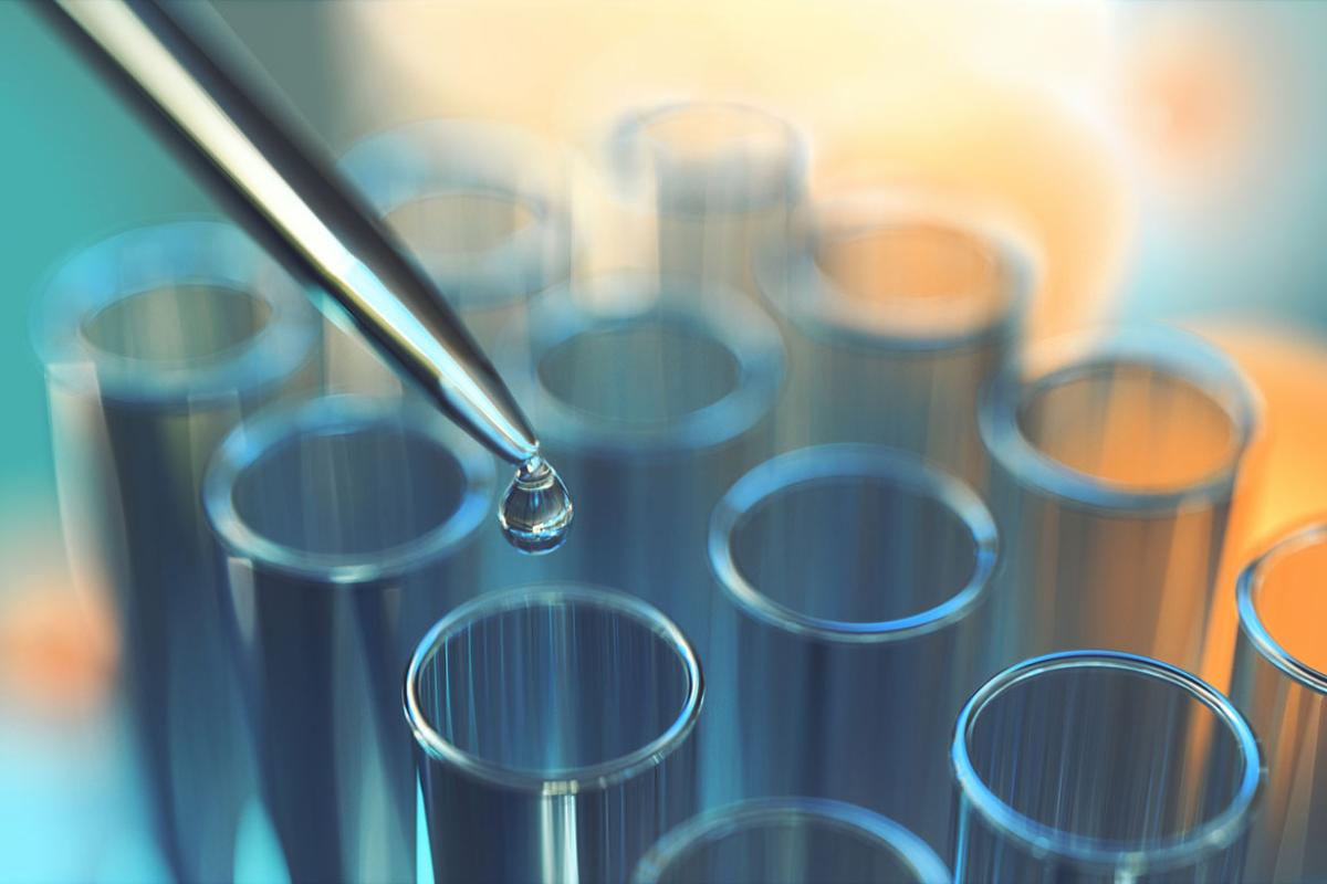 Test sample being pipetted into a tube