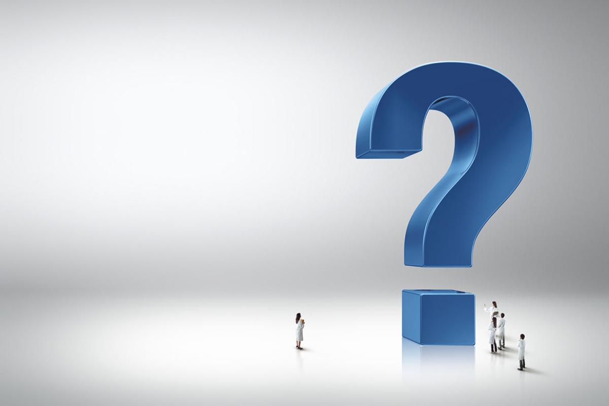 People surrounding a giant question mark