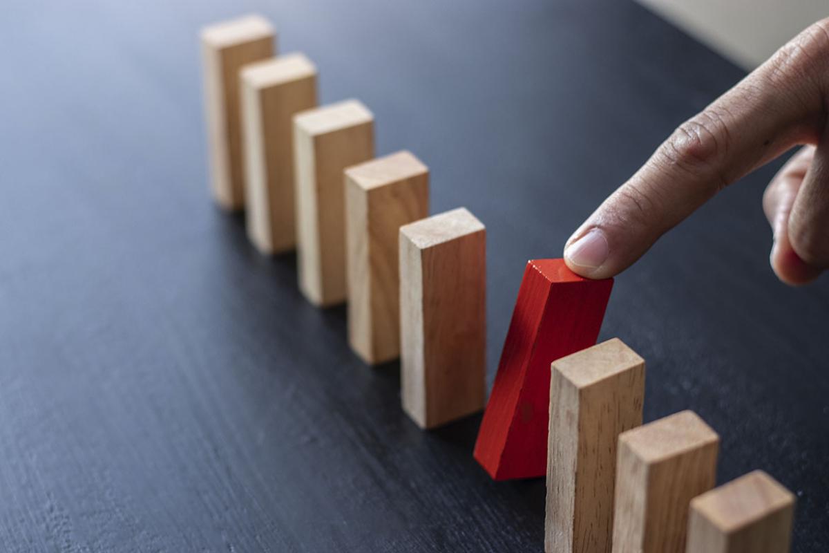 Forefinger identifies dissimilar wooden block