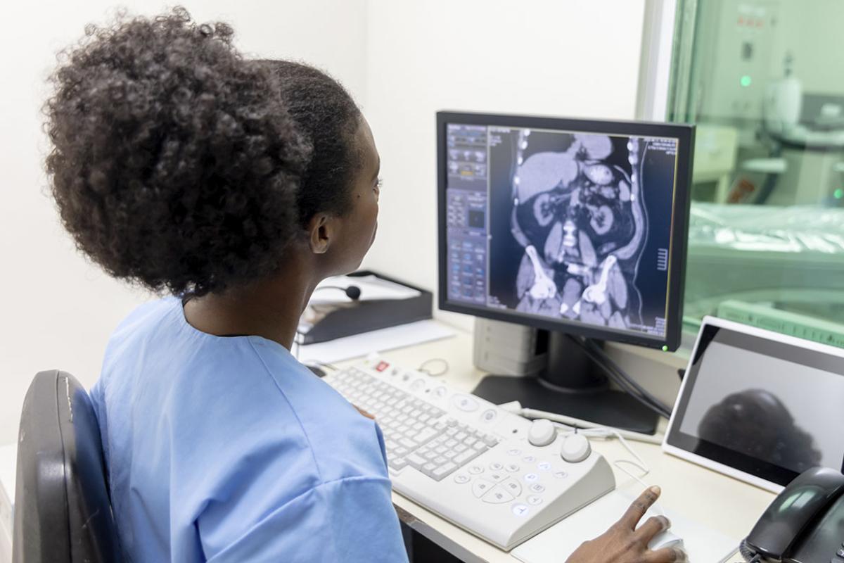 Radiologist looking at a CAT scan