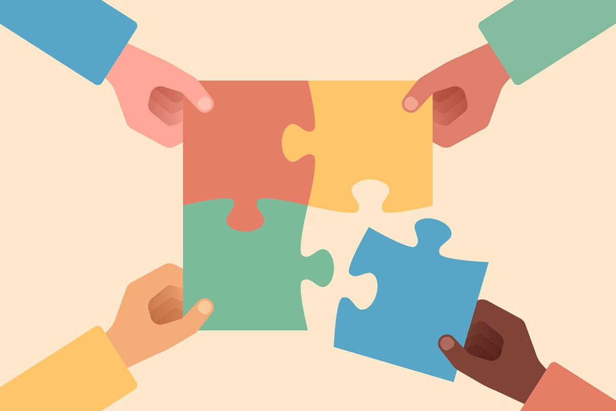 Hands putting a puzzle together
