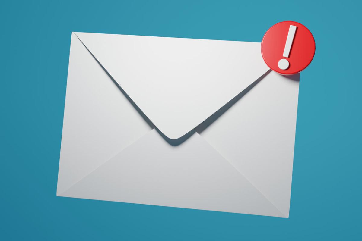 Envelope with a red exclamation point