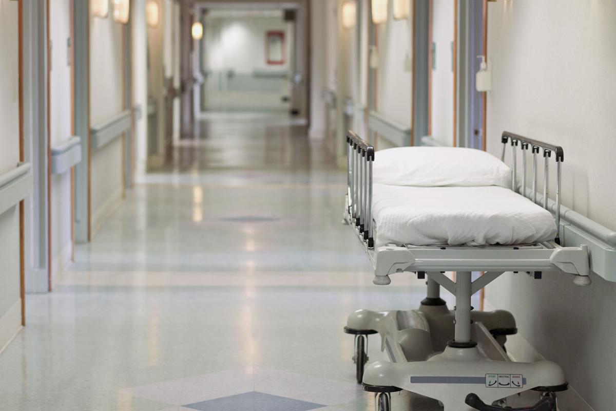 Gurney in hallway of hospital or medical center