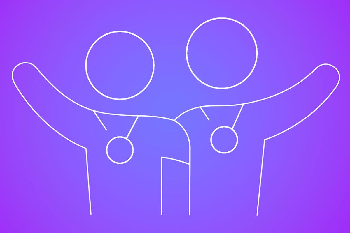 Two embracing figures wearing award medals