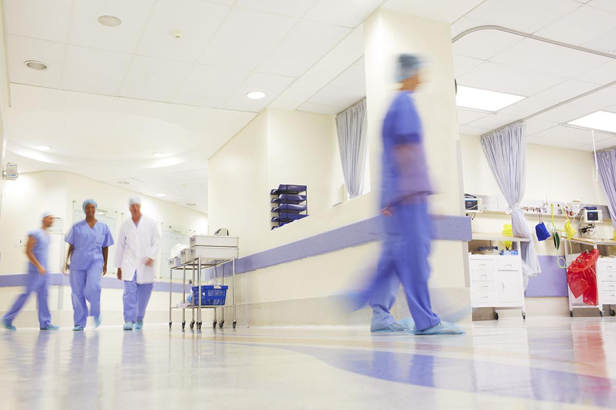 Doctors working in a busy hospital corridor