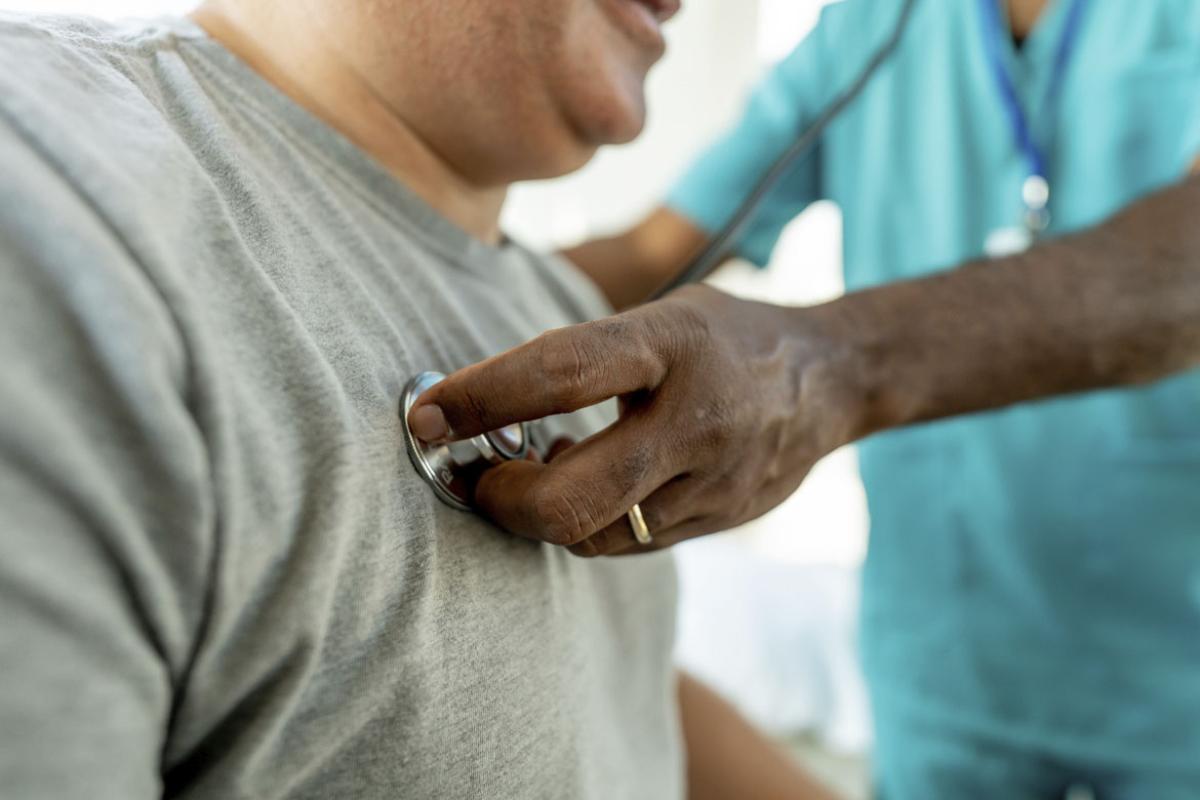 Patient with stethoscope on chest