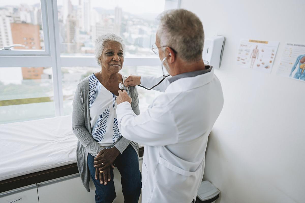 Doctor listening to a patient's heartbeat