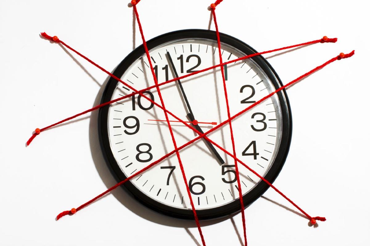 Clock covered in red tape
