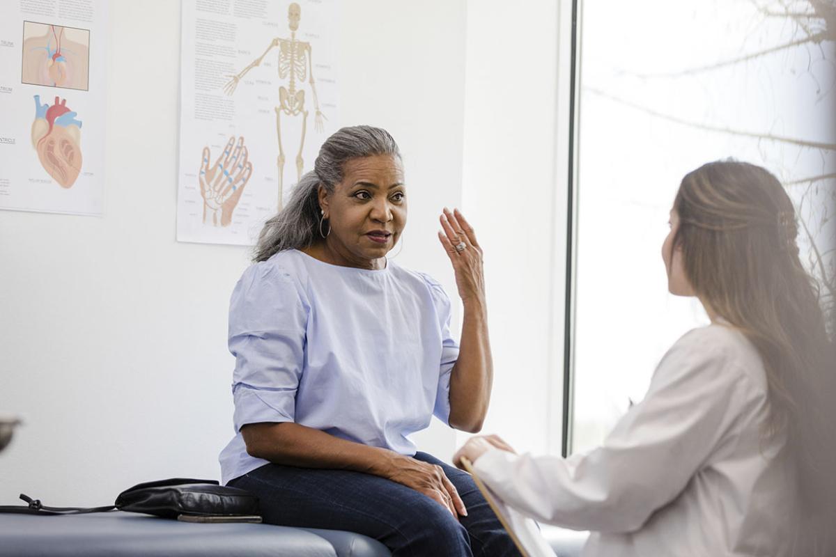 Senior patient talks to doctor