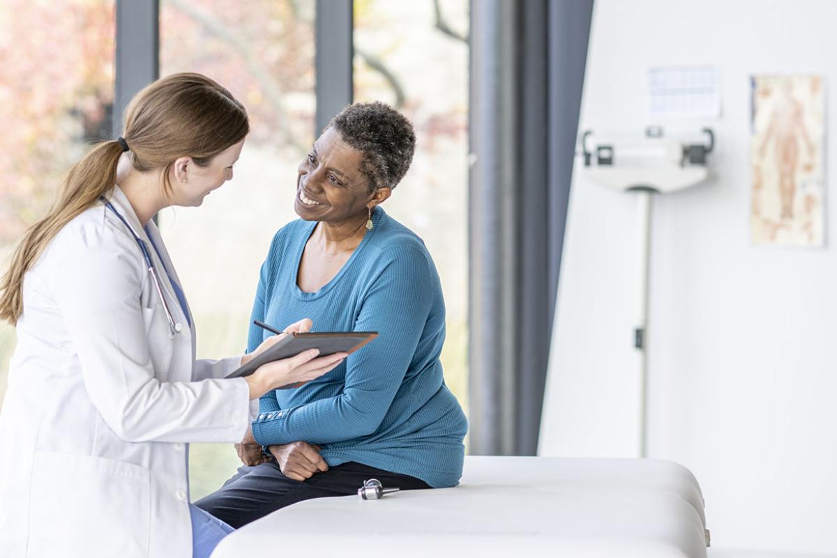 Smiling patient and physician