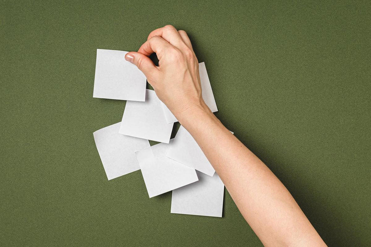 Hand pasting adhesive notes