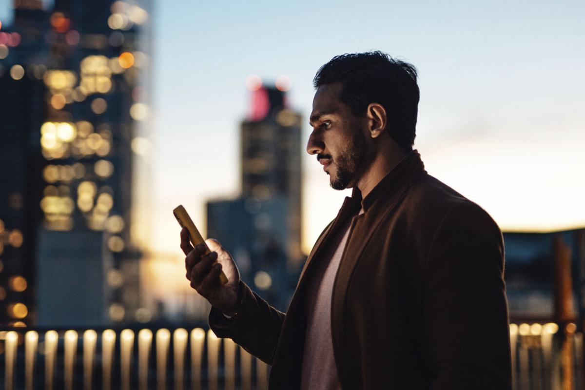 Person scrolling on a cell phone