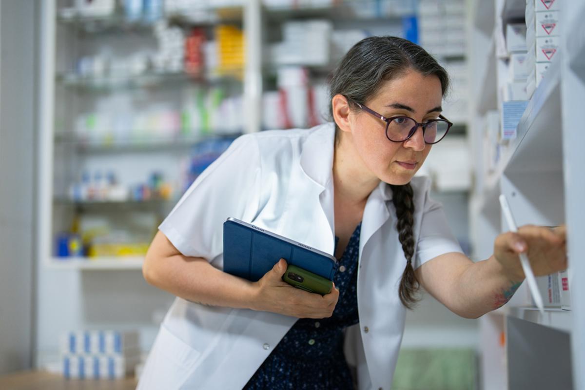 Pharmacist checking the stock of medications
