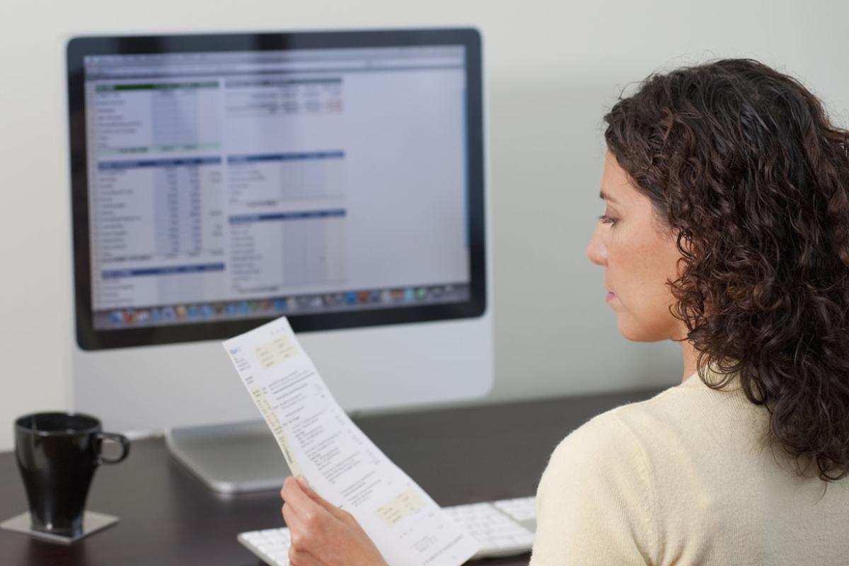 Woman paying bills on computer