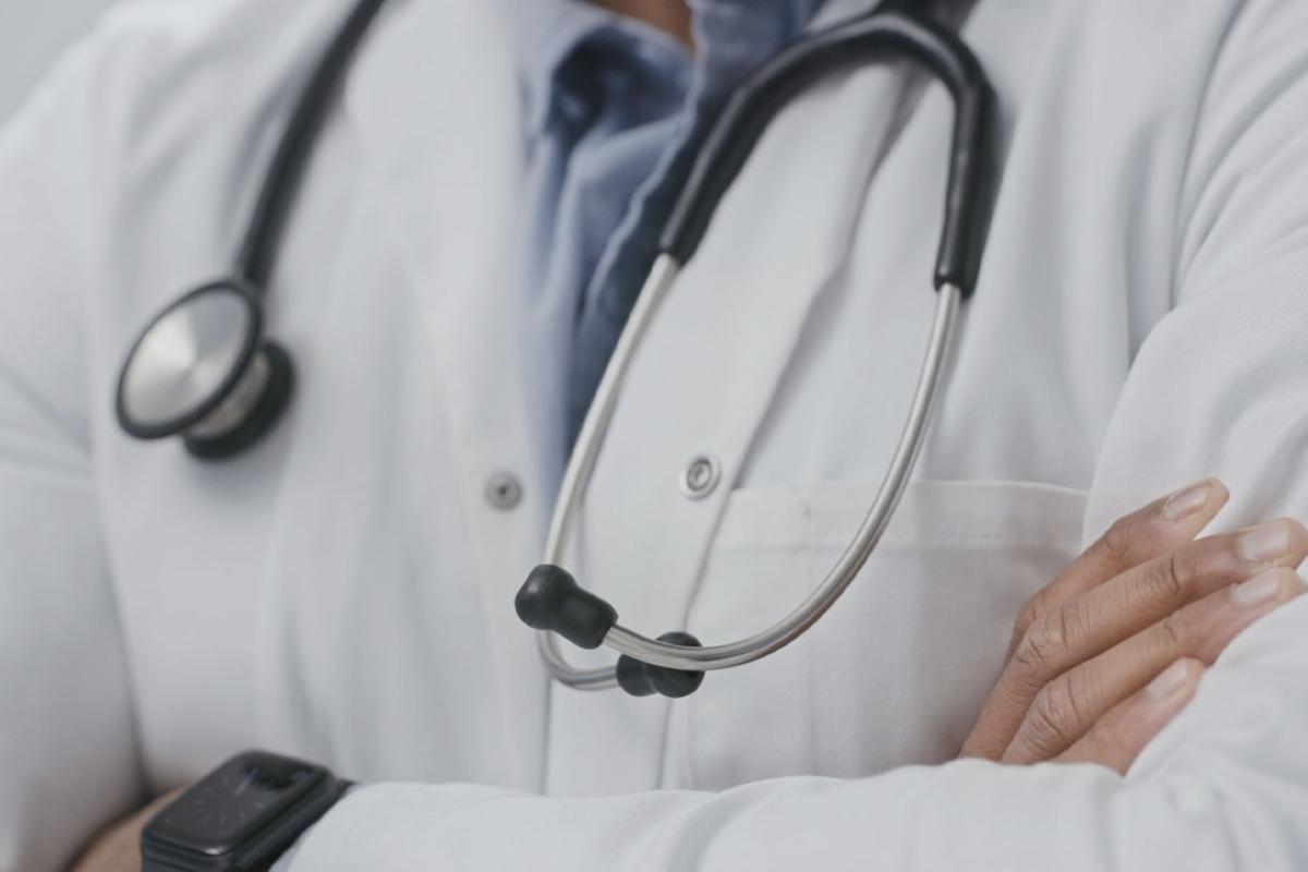 Physician with arms crossed