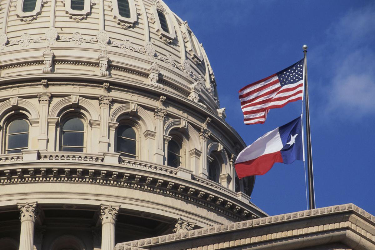 Texas State Capitol dome and flags