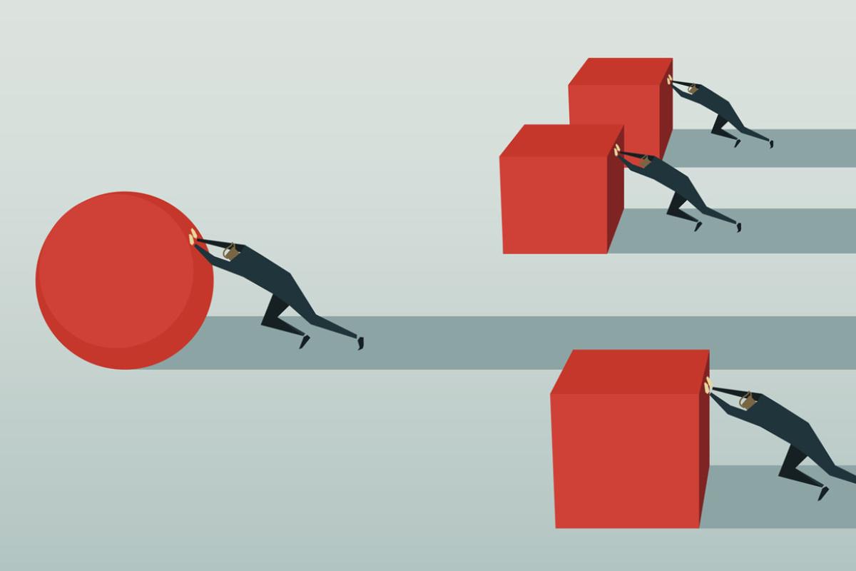 Figures pushing large blocks