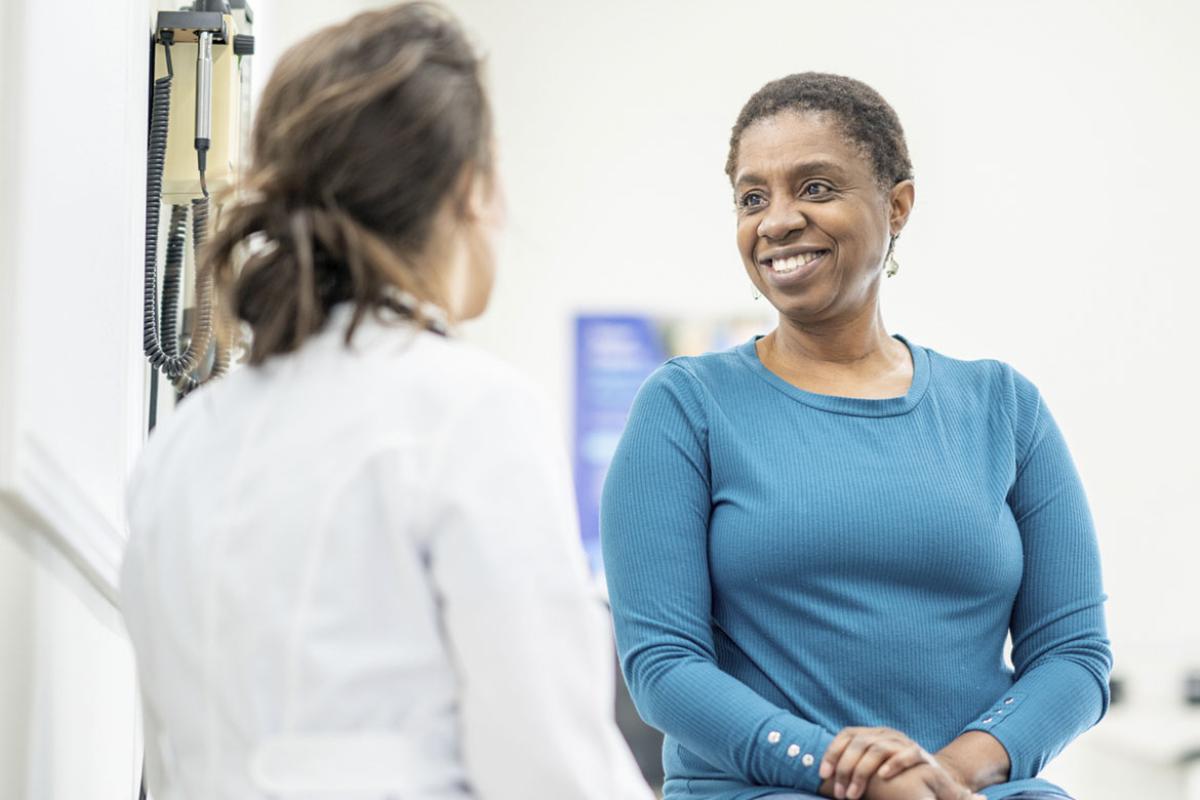 Patient listening attentively to a physician during a routine check-up