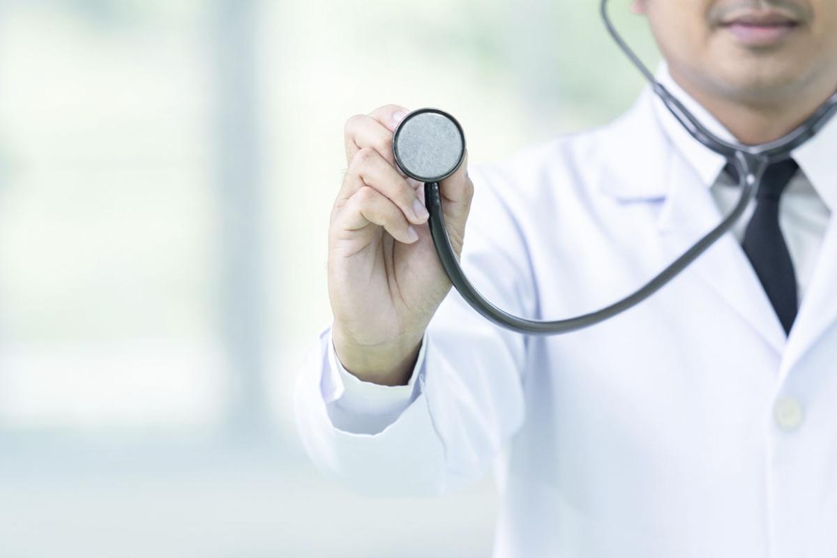 Doctor and stethoscope in hand