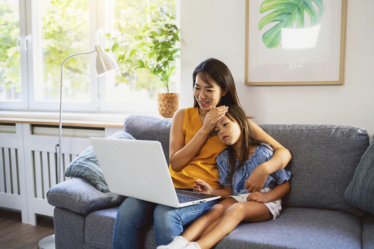 Parent and young child in a telehealth appointment