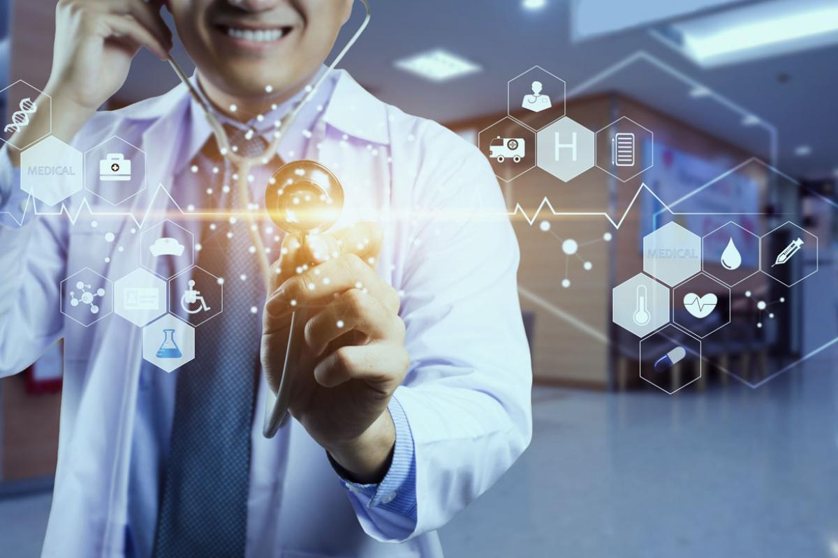 Doctor with stethoscope in hand touching icon medical network connection