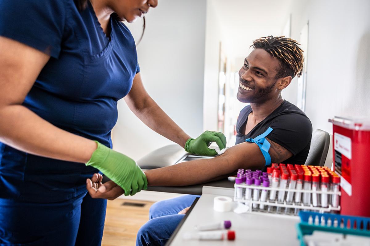 Smiling patient being prepped for blood draw