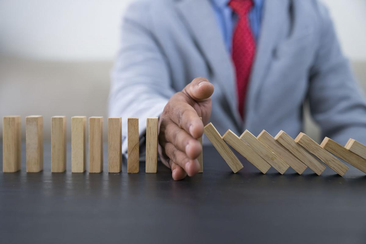 Hand interrupts a series of falling blocks