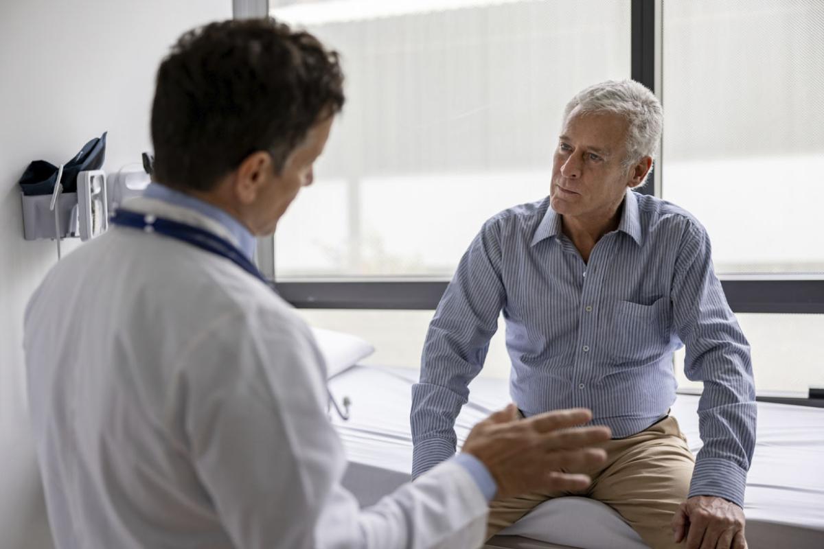 Doctor talking to a patient in a consultation at the office
