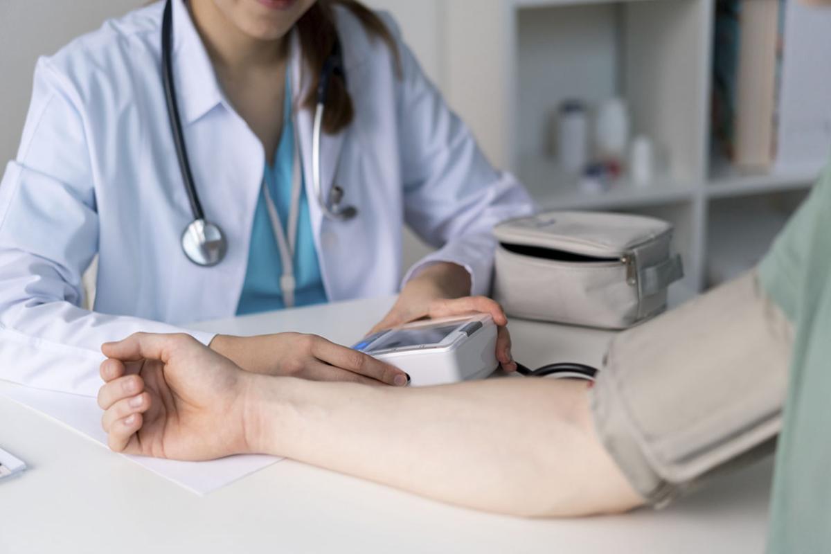 Doctor measuring blood pressure