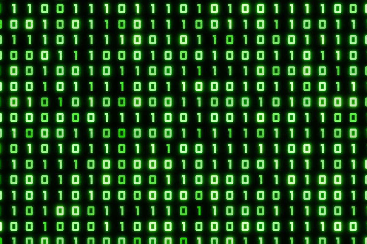 Computer screen displaying zeroes and ones