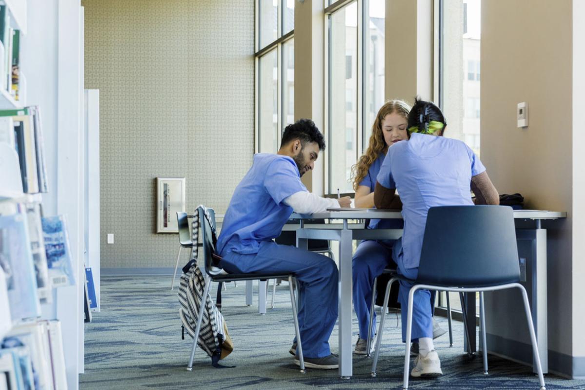 Group of medical students studying in a library