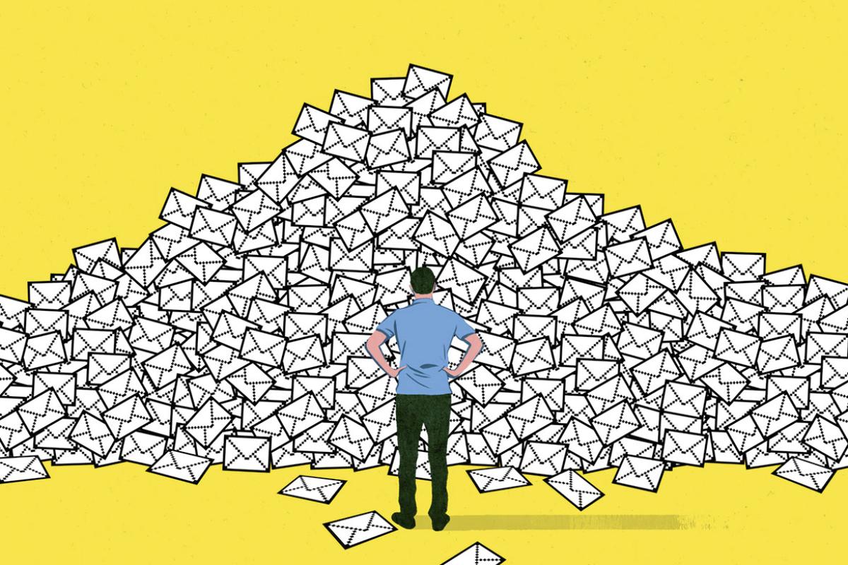 Figure stands in front of a large pile of envelopes