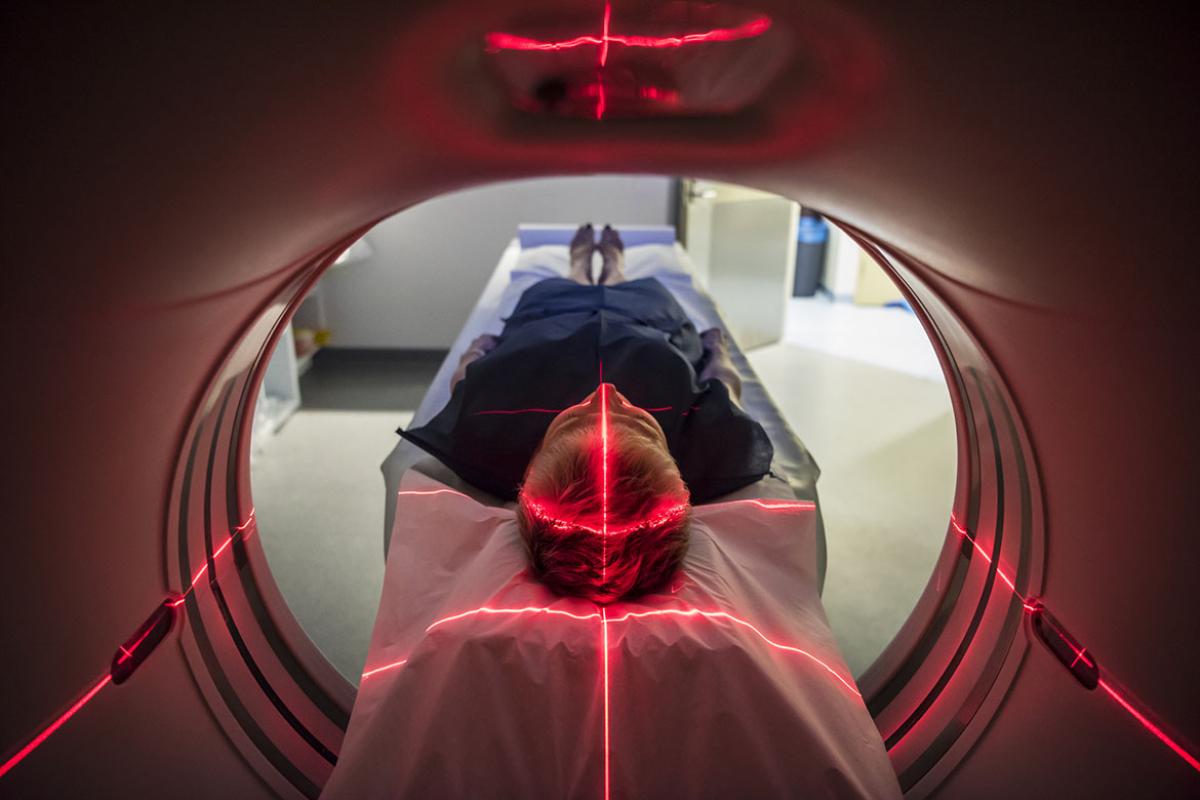 Person undergoing a CAT scan in hospital
