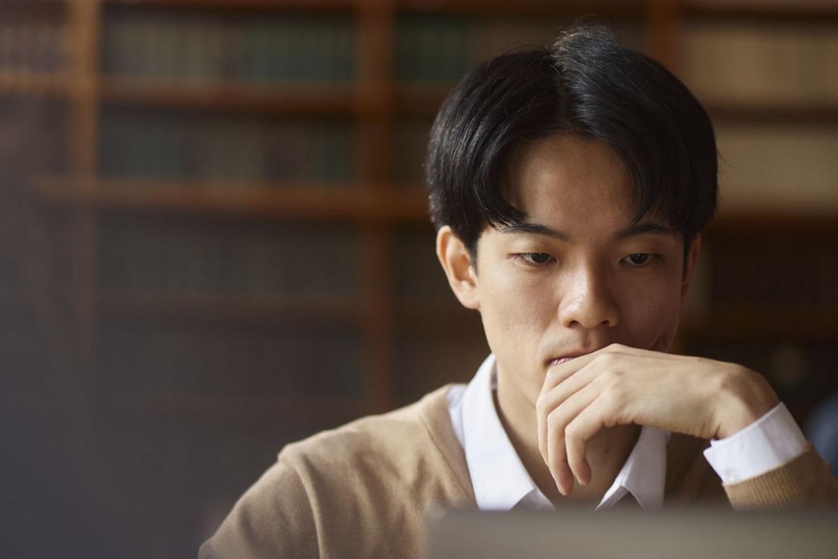 Student studying in front of a laptop
